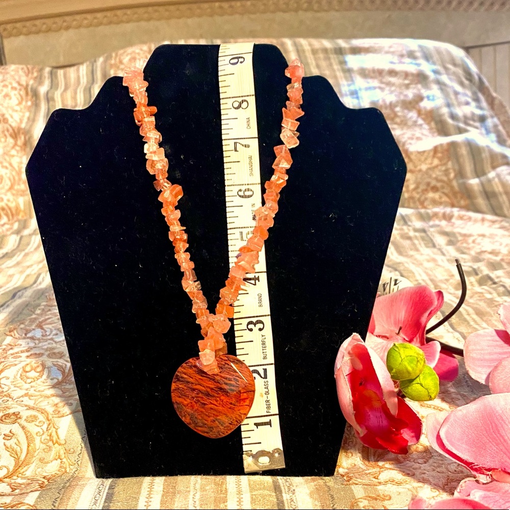 Rose quartz necklace with acrylic pendant.